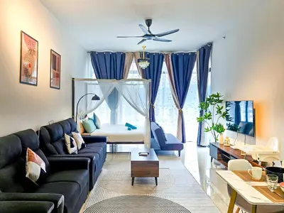 a living room with a couch and a table at Beacon Executive Suite by NGN - Georgetown Penang in George Town