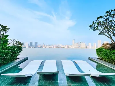 a swimming pool with a view of the water at Beacon Executive Suite by NGN - Georgetown Penang in George Town