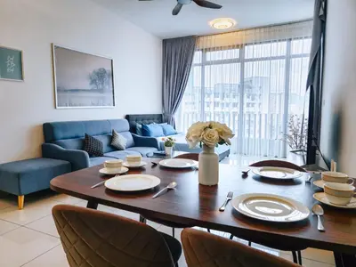 a living room with a table and a couch at Beacon Executive Suite by NGN - Georgetown Penang in George Town