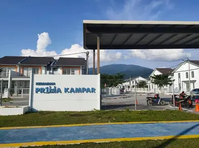 a gas station with a sign that reads pita karmapa at Homestay Kampar Putra in Kampar