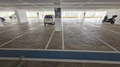 a parking lot with a small van parked in it at H&W Sunway Onsen Suites Services Tambun Ipoh S-15-12 in Ipoh