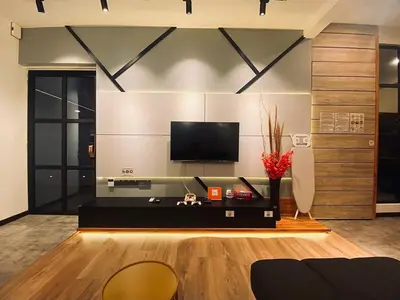 a living room with a flat screen tv on a wall at SIX Boutique Residence @ Ipoh Garden Landed House 8pax in Ipoh