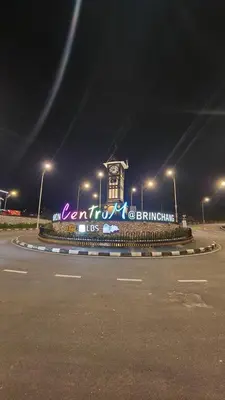 a building with a clock tower at night at The Gladiator Homstay in Brinchang