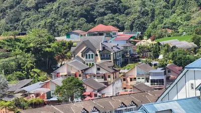 an aerial view of a village with houses at The Gladiator Homstay in Brinchang