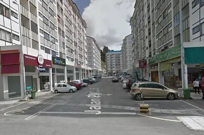 a city street with parked cars and buildings at ForestNest Cameron Town Spacious 3R3B (1300 sqft) in Tanah Rata