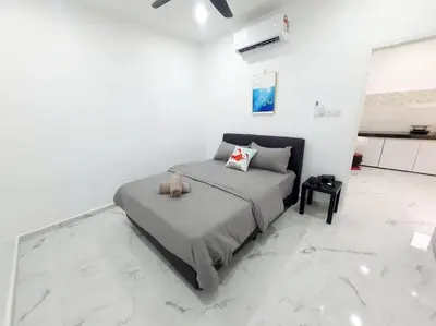 a bedroom with a bed in a white room with marble floors at (New)Jovial Cozy&Stylish House 4Room@BM Sri Rambai in Bukit Mertajam