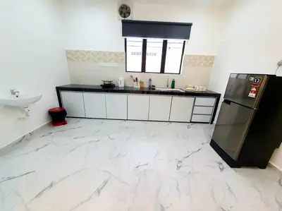 a kitchen with a counter and a sink and a refrigerator at (New)Jovial Cozy&Stylish House 4Room@BM Sri Rambai in Bukit Mertajam