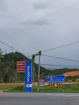 a group of signs on the side of a road at D'Impiana Riverview Chalet # Lenggong in Kampong Ulu Jepai