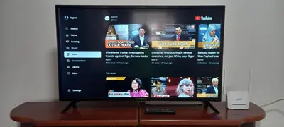 a flat screen tv sitting on top of a wooden table at 4 Bedrooms Ipoh Landed House, Ipoh Town in Ipoh