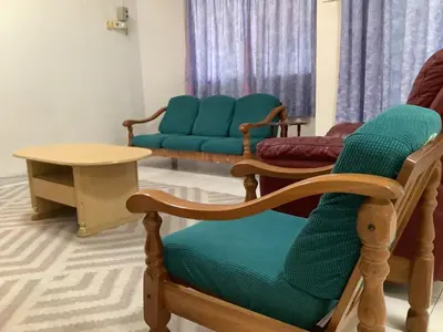 a room with chairs and a table and a couch at 4 Bedrooms Ipoh Landed House, Ipoh Town in Ipoh