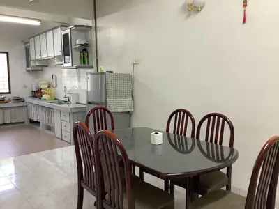 a dining room table and chairs in a kitchen at 4 Bedrooms Ipoh Landed House, Ipoh Town in Ipoh
