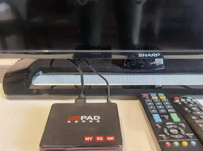 a remote control sitting on top of a tv at Emerald Avenue Cozy 3R3B Apartment 830 in Brinchang