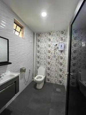 a bathroom with a toilet and a sink at Tekoma Hotel & Hostel Cameron Highlands - FREE SHUTTLE SERVICE in Tanah Rata