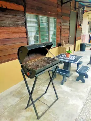 a grill sitting on top of a table at Teratak Desa Umaira in Tanjung Karang