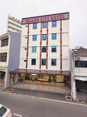 a building with a sign that reads island city hostel at Capital O 90897 Island City Hotel in George Town