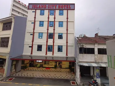 a building with a sign that reads island city hospital at Capital O 90897 Island City Hotel in George Town