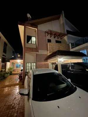 a car parked in front of a house at night at G Residence - Cosy 4R3B Semi-D in Brinchang Town in Brinchang