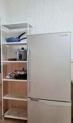a refrigerator in a kitchen with its door open at G Residence - Cosy 4R3B Semi-D in Brinchang Town in Brinchang