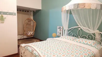 a bedroom with a bed with a canopy at G Residence - Cosy 4R3B Semi-D in Brinchang Town in Brinchang