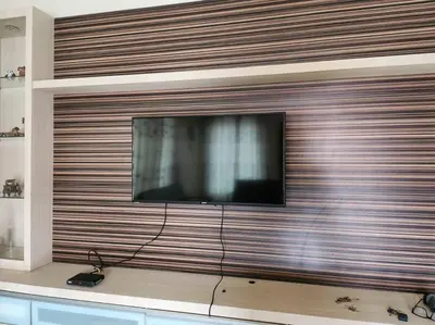 a flat screen tv sitting on top of a wall at Gated Family House- next to MRSM in Kampong Kawak