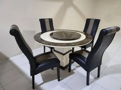 a table with four chairs and a table with a marble top at Gated Family House- next to MRSM in Kampong Kawak