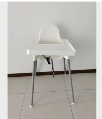 a white chair sitting on top of a floor at LM HomeyB 3BR Coastline Family Suite for 4-14 Pax with Nexflix & Coway Water Purifier in Tanjong Tokong