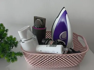 a basket with some items in it next to a plant at LM HomeyB 3BR Coastline Family Suite for 4-14 Pax with Nexflix & Coway Water Purifier in Tanjong Tokong