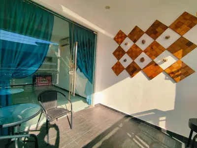 a glass table and a chair in a room at C Boutique Townhouse Station 18 Ipoh By irainbow in Ipoh