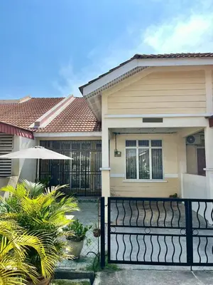 a house with a black fence in front of it at Rumah Tamu by Perdana Hōmes for Múslim only in Sungai Petani