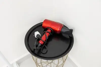 a red blow dryer sitting on top of a hoop at Taiping Aulong [3 rooms] nearby TF Mart/Econsave in Taiping