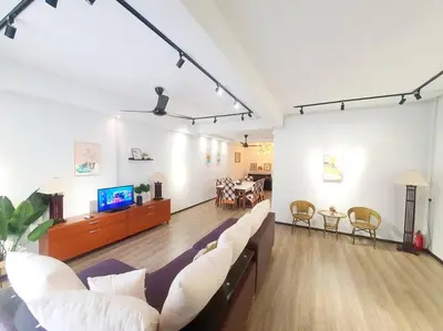 a large living room with a couch and a tv at (TS) Cozy House 4 Room10Pax@ALMA in Bukit Mertajam