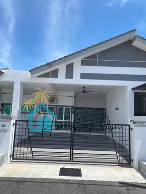 a white house with a gate in front of it at Homestay Ibu in Lumut