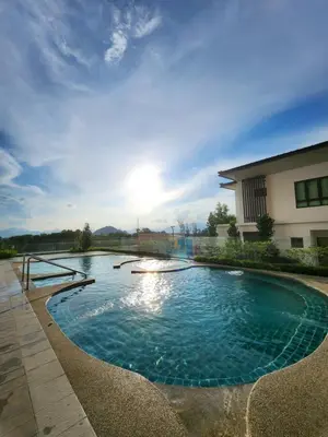 a swimming pool in front of a building at Sunway onsen suite ipoh in Ipoh