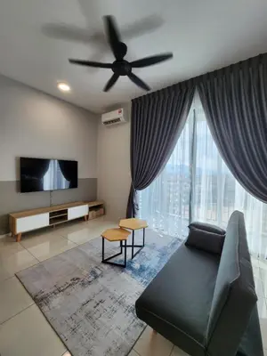 a living room with a couch and a ceiling fan at Sunway onsen suite ipoh in Ipoh