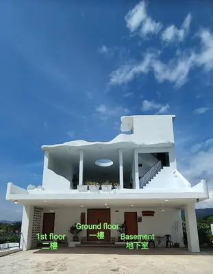 a large white building with a first floor and a first flooracistacistaciststration at Sunya Home G02 Raub Pahang in Raub