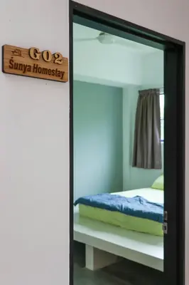 a mirror in a room with a bed at Sunya Home G02 Raub Pahang in Raub