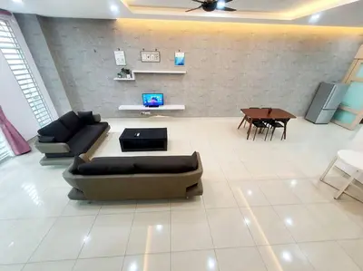 a living room with a couch and a table at MODERN STYLISH 2STOREY HOUSE 8PAX@ALMA NEAR JUSCO in Bukit Mertajam