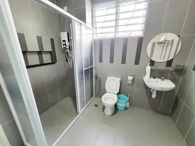 a bathroom with a shower and a toilet and a sink at MODERN STYLISH 2STOREY HOUSE 8PAX@ALMA NEAR JUSCO in Bukit Mertajam