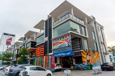 a building with cars parked in a parking lot at \u3010NEW\u3011Modern Comfort Studio@Juru Sentral Icon City in Bukit Mertajam