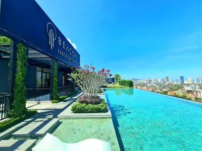 a swimming pool in front of a building at Beacon Executive Suite - Skypool Penang View in George Town