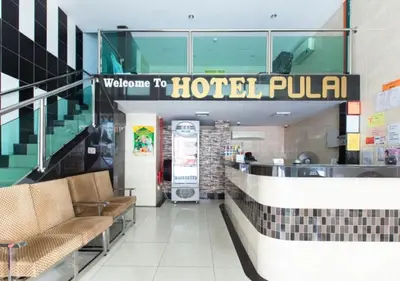 a hotel lobby with a welcome to hotel pula at Hotel Pulai Ipoh in Ipoh