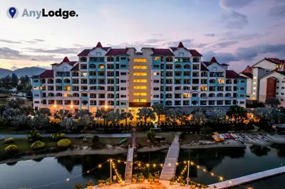 a large hotel with a lake in front of it at AnyLodge Waterfront Marina Island Pangkor-Lumut in Lumut