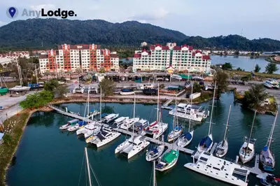 a group of boats docked at a marina in a city at AnyLodge Waterfront Marina Island Pangkor-Lumut in Lumut