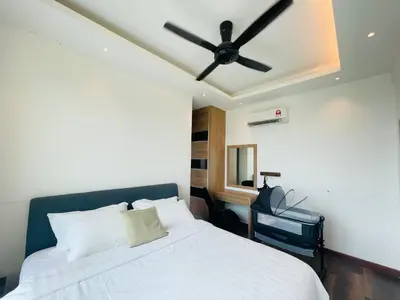 a bedroom with a white bed with a ceiling fan at Ipoh D Festivo Suites 6-10pax 10mins to Sunway Tambun by IWH in Ipoh