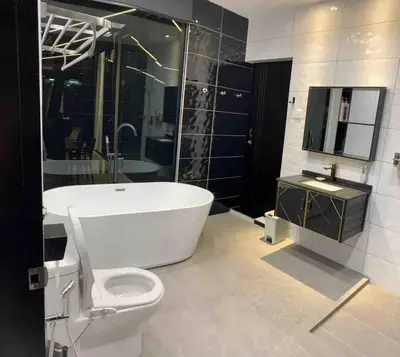 a bathroom with a tub and a toilet and a sink at Abbie's Private Pool Villa Bukit Mertajam Penang in Bukit Mertajam