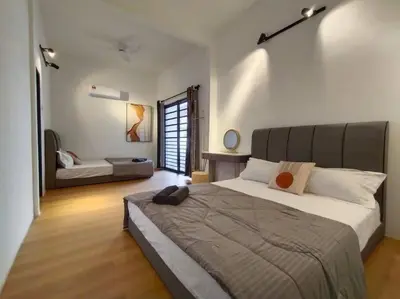 a bedroom with a large bed in a room at Bole Villa-Private Pool-BBQ-Karaoke 20pax in Ipoh