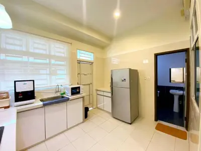 a kitchen with a refrigerator and a sink at Modern COZY SINGLE STOREY HOUSE ```` ALMA JUSCO BM in Bukit Mertajam