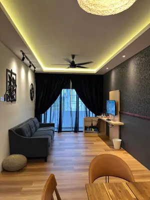 a living room with a couch and a table at Adik Aisyah Black forest Cameron Highlands homestay For Muslim in Cameron Highlands