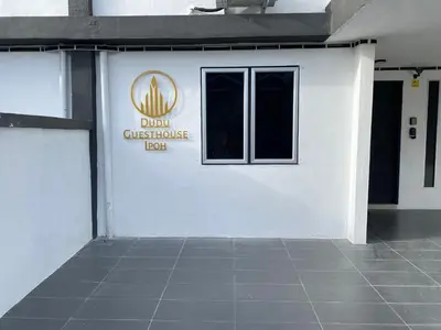 a white building with a window on the side of it at Dudu Guesthouse Ipoh in Ipoh