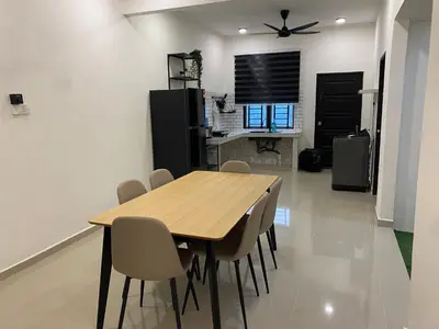 a dining room with a wooden table and chairs at Dudu Guesthouse Ipoh in Ipoh